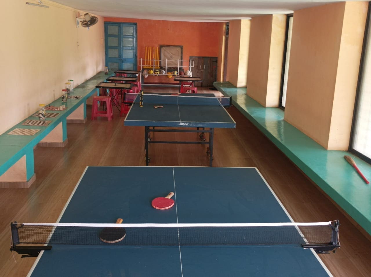 Students practicing sports at school sports room